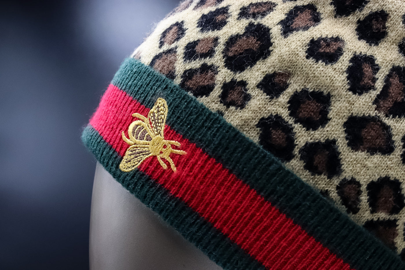 Knitted Leopard-Printed Wool Hat with Finn Raccoon Pom-Pom